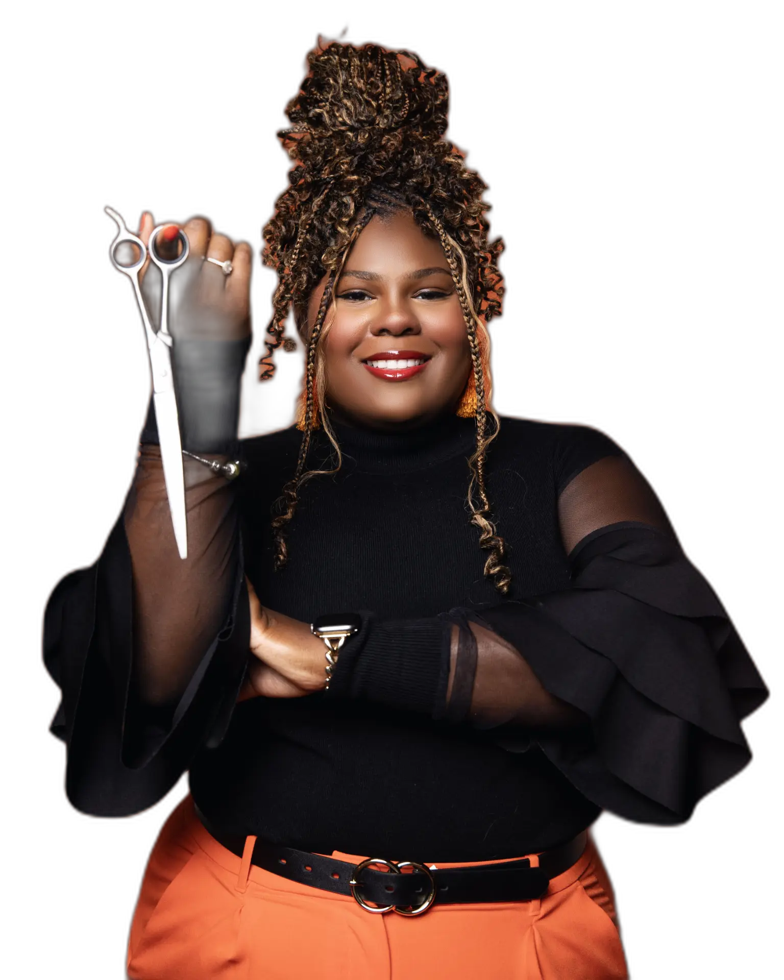 Dominque Willis, Licensed Cosmetologist and Certified Scalp Expert, holding shears